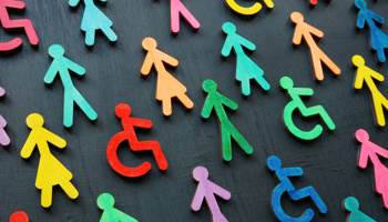 Multi-coloured people icons, some standing and some using wheelchairs